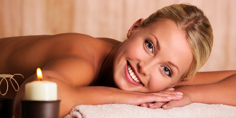 beautiful smiling female lying down in beauty salon